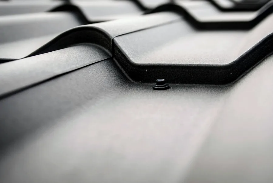A seam on a dark metal roof panel